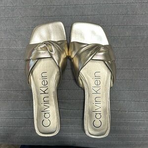 Gold Calvin Klein sandals